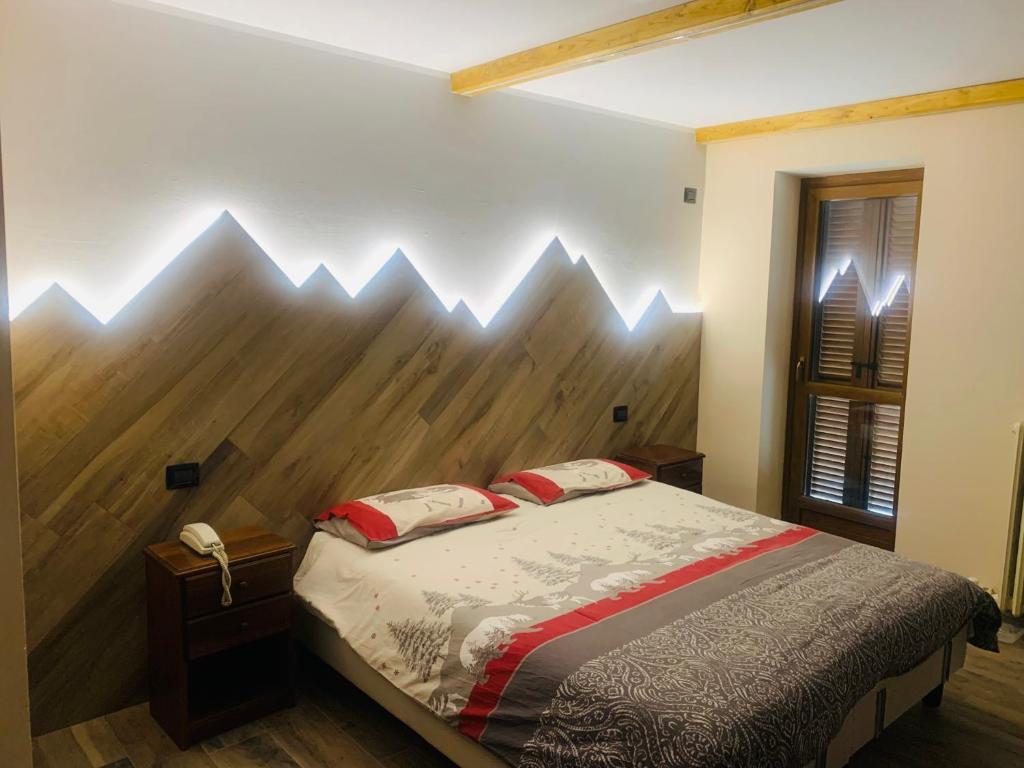 Postel nebo postele na pokoji v ubytování Hotel Ristorante Ligure