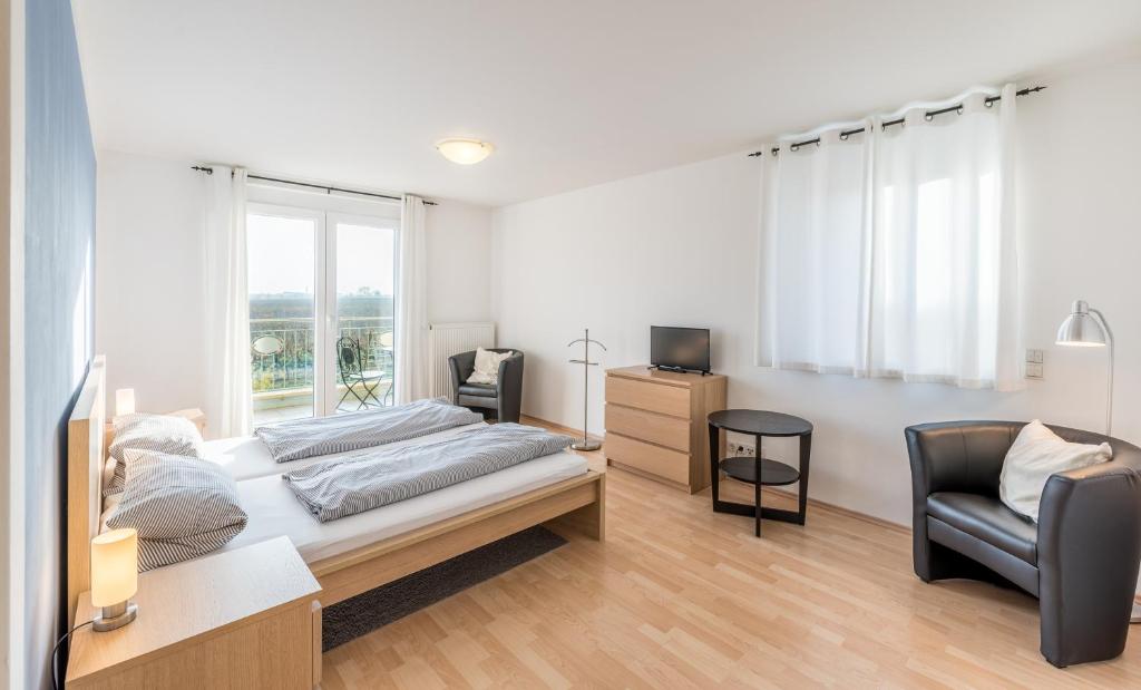 Postel nebo postele na pokoji v ubytování Gästehaus Weingut Glas