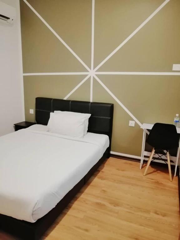 Postel nebo postele na pokoji v ubytování Gem Hotel Nusa Sentral Nusajaya
