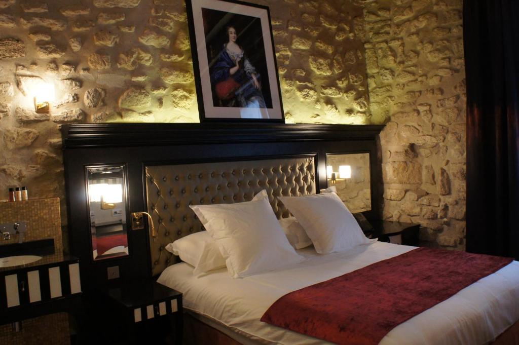 Un ou plusieurs lits dans un hébergement de l'établissement Tonic Hotel Saint Germain des Prés