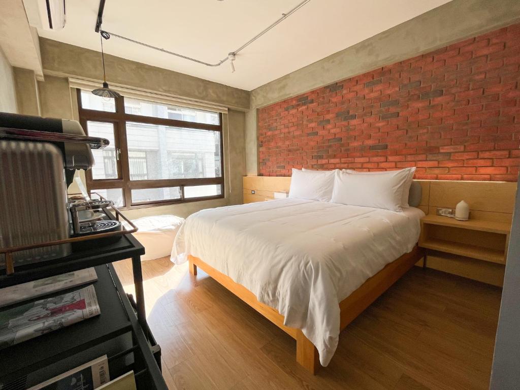 Postel nebo postele na pokoji v ubytování 鬧鐘關掉旅店 Alarm Off B&B