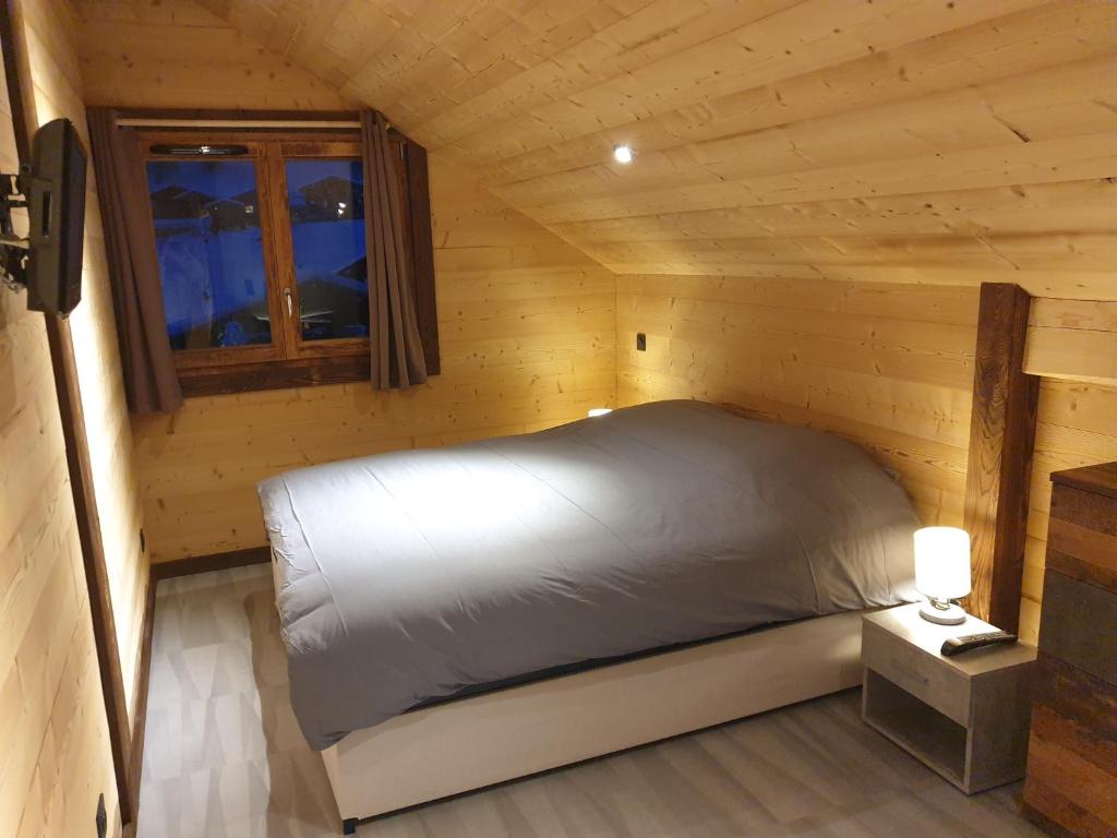 Postel nebo postele na pokoji v ubytování CHALET LES CERFS