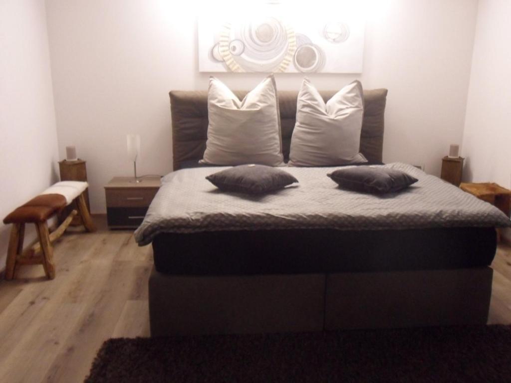 a bedroom with a bed with two pillows on it at Luxusferienwohnung-Mager in Freyung