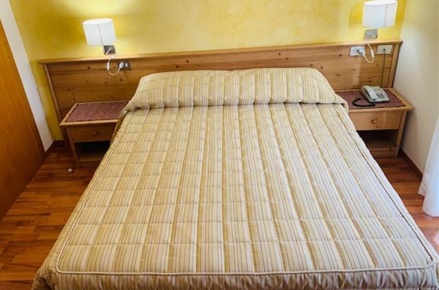 Postel nebo postele na pokoji v ubytování Hotel Genzianella
