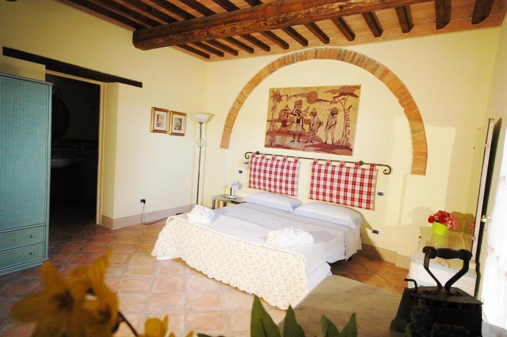 Postel nebo postele na pokoji v ubytování Agriturismo Le Querce