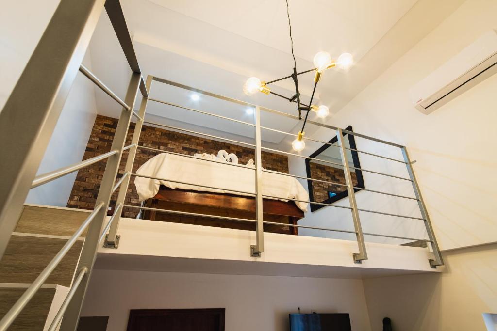 a room with a bed in the middle of a building at Hotel Revolución in Tijuana