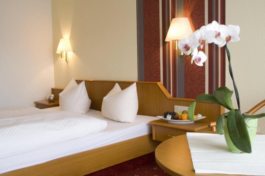 Voodi või voodid majutusasutuse Hotel Thüringer Hof toas