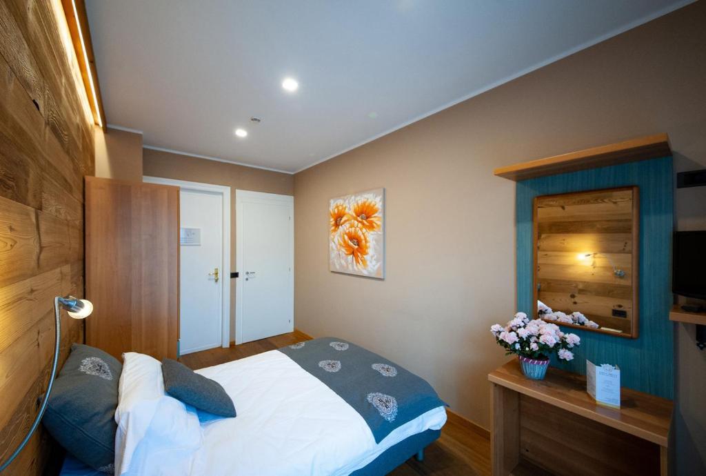 Postel nebo postele na pokoji v ubytování Albergo San Carlo
