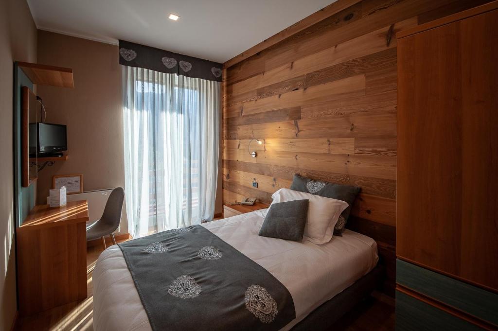 Postel nebo postele na pokoji v ubytování Albergo San Carlo
