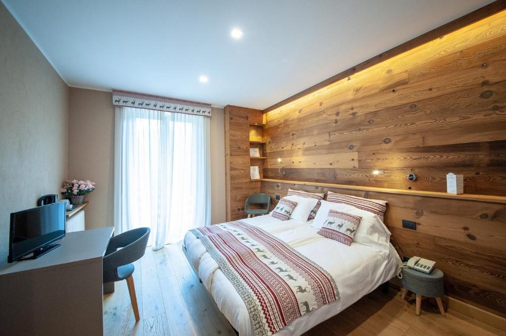 Postel nebo postele na pokoji v ubytování Albergo San Carlo