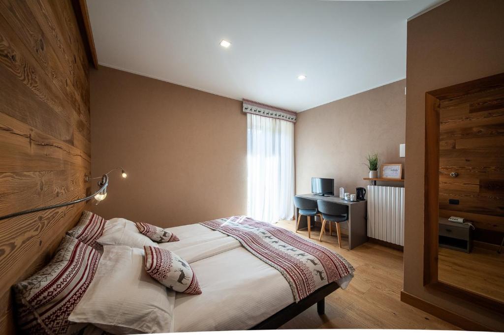 Postel nebo postele na pokoji v ubytování Albergo San Carlo