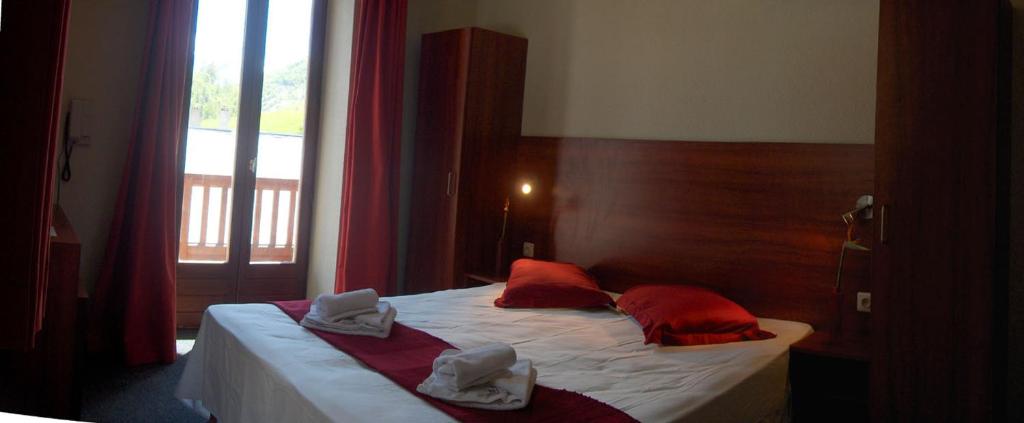 Postel nebo postele na pokoji v ubytování Hotel Chalet du Crey