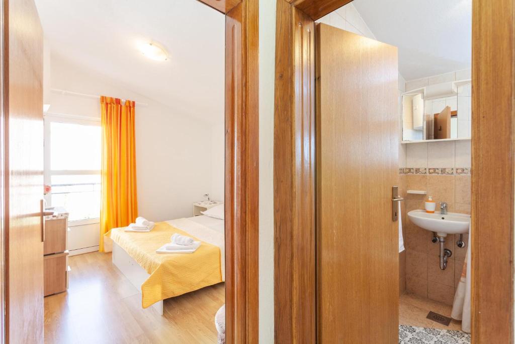 Posteľ alebo postele v izbe v ubytovaní Apartman Prlić 3