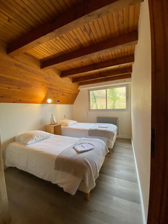 Postel nebo postele na pokoji v ubytování Hotel Le Chalet