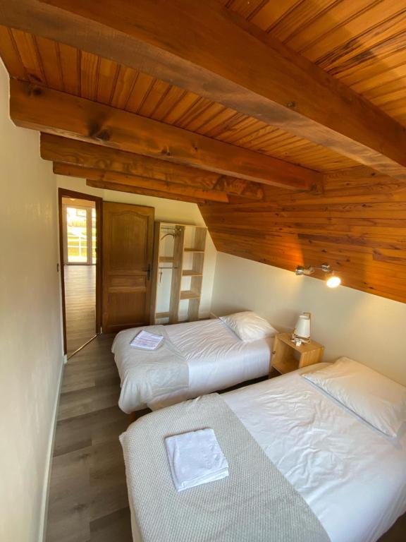Postel nebo postele na pokoji v ubytování Hotel Le Chalet