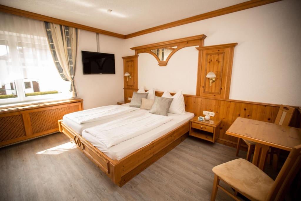 Postel nebo postele na pokoji v ubytování Pension Knoll