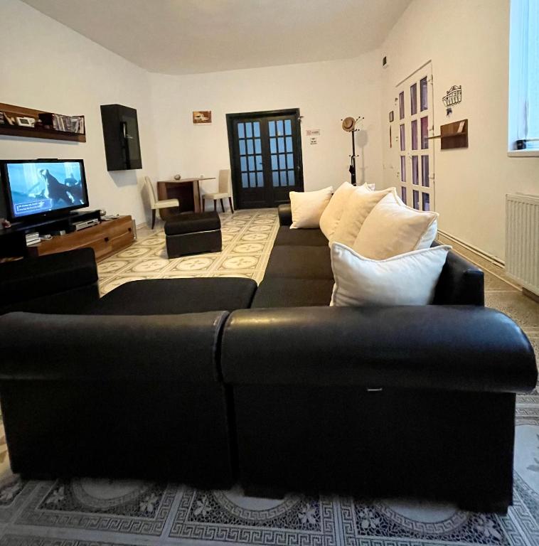 TV a/nebo společenská místnost v ubytování Mosaico Alfetta Hostel