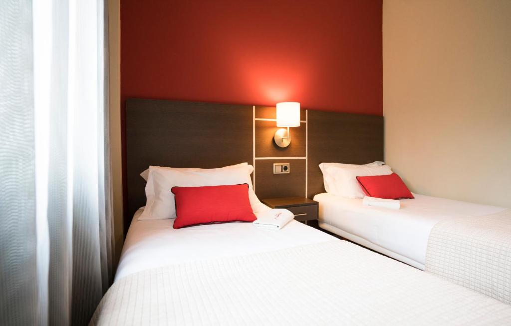 Postel nebo postele na pokoji v ubytování Hotel Piramide 2