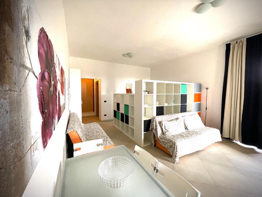 a bedroom with a bed and a table in it at Casa Serra in Porto Palo