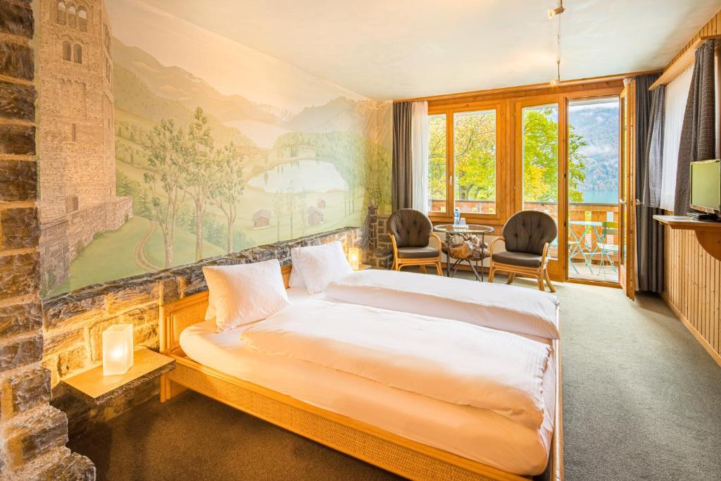 Кровать или кровати в номере Hotel Lindenhof by Crossworld AG