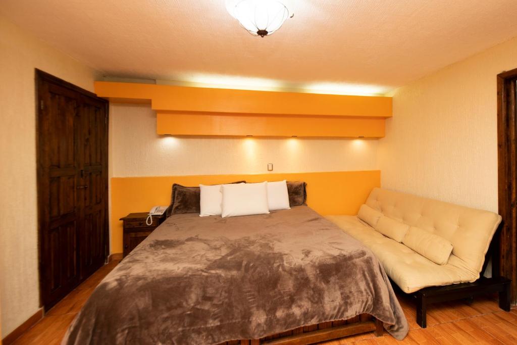 Postel nebo postele na pokoji v ubytování Gran Hotel El Encanto