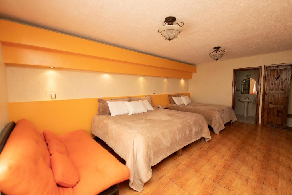 Postel nebo postele na pokoji v ubytování Gran Hotel El Encanto