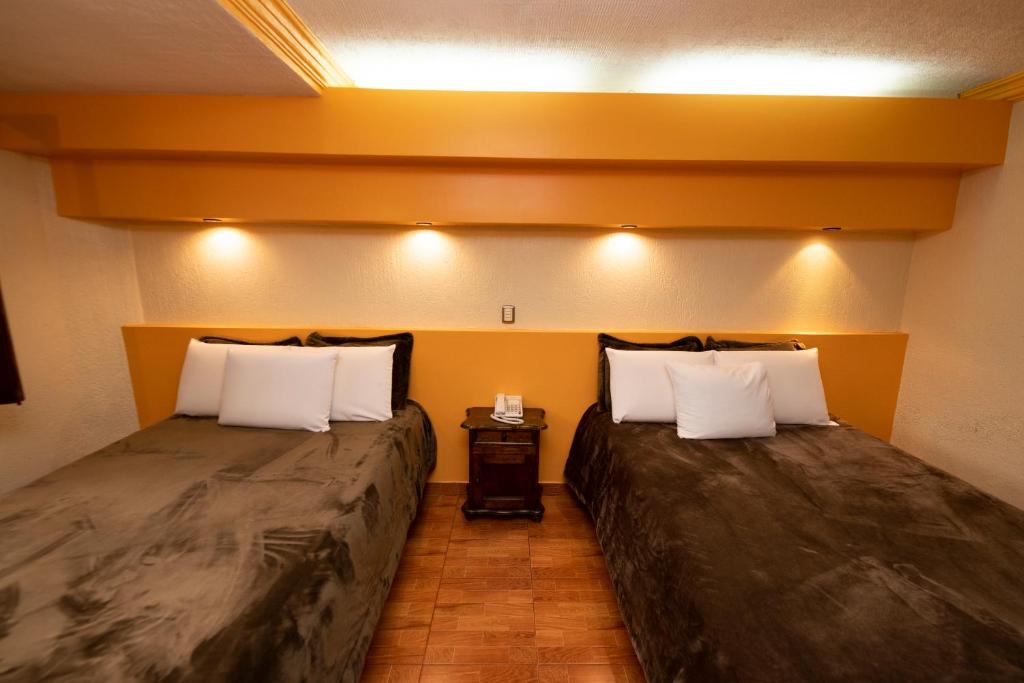 Postel nebo postele na pokoji v ubytování Gran Hotel El Encanto