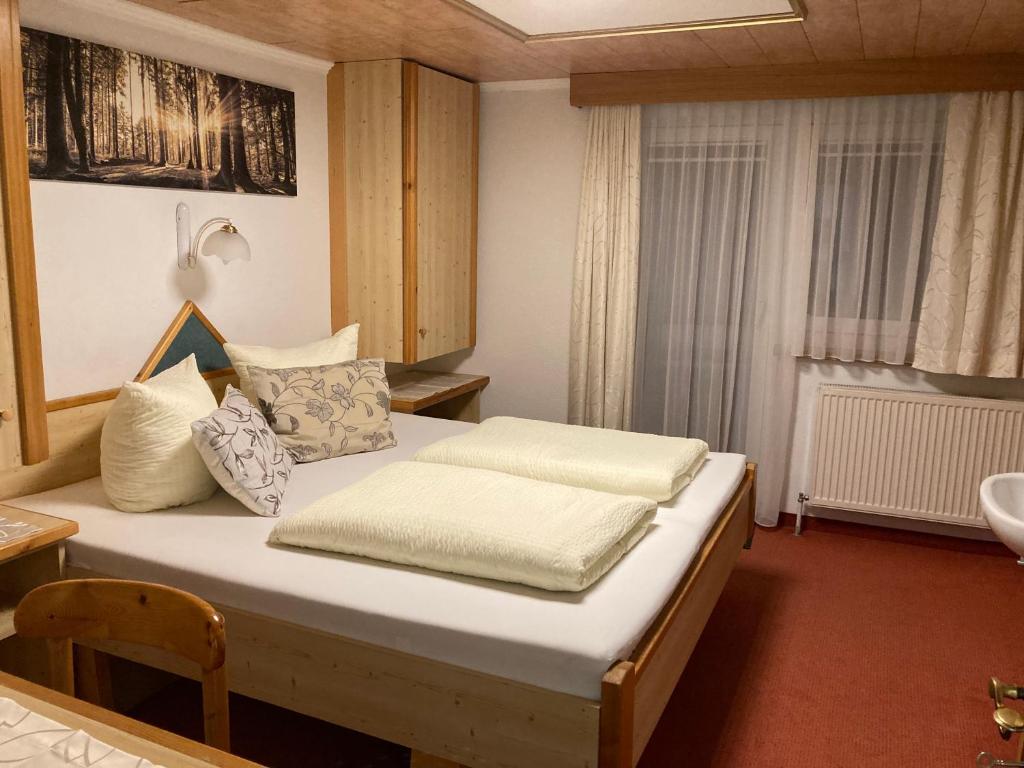 Postel nebo postele na pokoji v ubytování Apart Garni Dorfblick