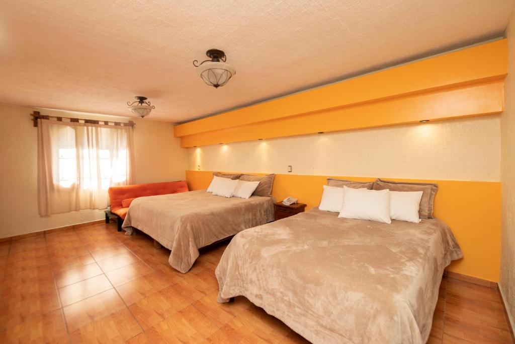 Postel nebo postele na pokoji v ubytování Gran Hotel El Encanto