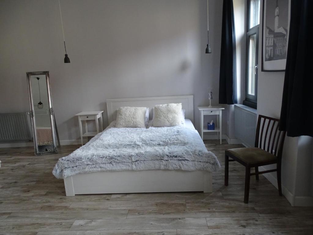 Posteľ alebo postele v izbe v ubytovaní Óváros Apartman