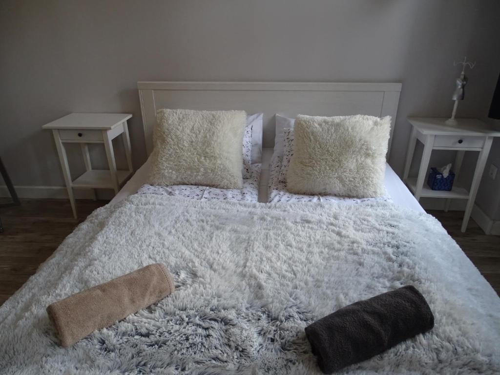 Posteľ alebo postele v izbe v ubytovaní Óváros Apartman