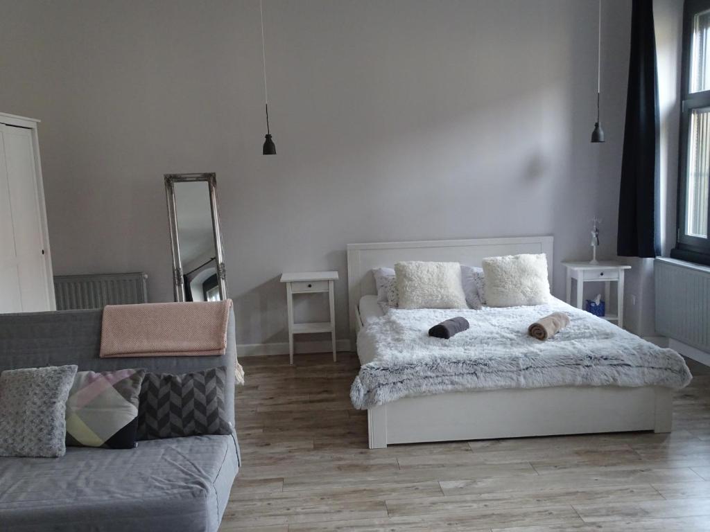 Posteľ alebo postele v izbe v ubytovaní Óváros Apartman