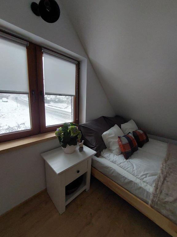 Postel nebo postele na pokoji v ubytování Chatka Podgórna