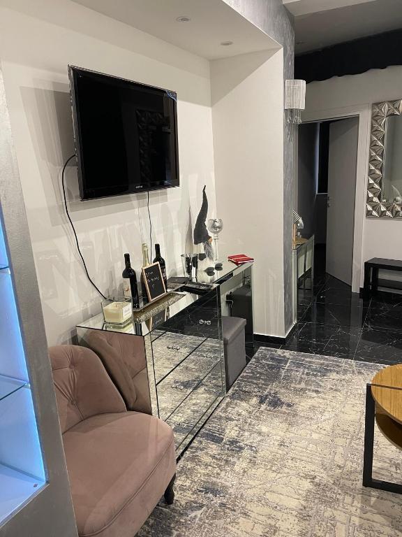 Televízia a/alebo spoločenská miestnosť v ubytovaní Apartman Slay
