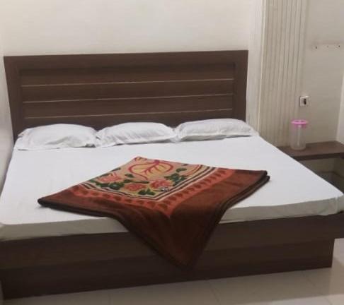 Voodi või voodid majutusasutuse Sahiba Palace toas