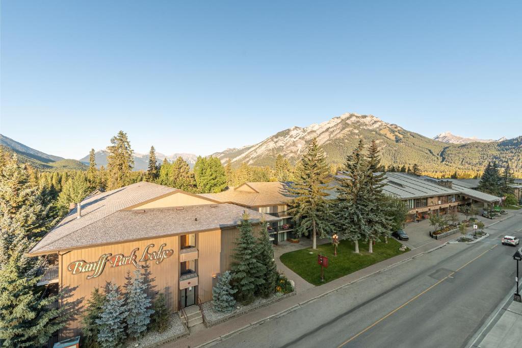 a small town with a mountain range at Banff Park Lodge in Banff