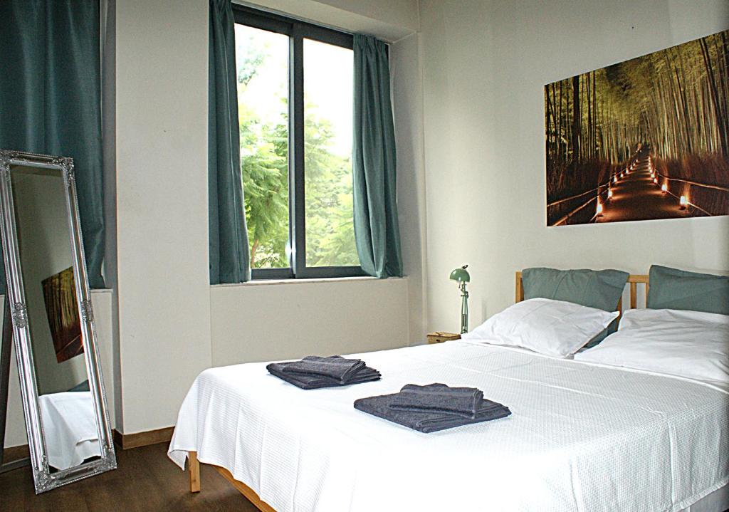 Łóżko lub łóżka w pokoju w obiekcie Central studio in Monastiraki