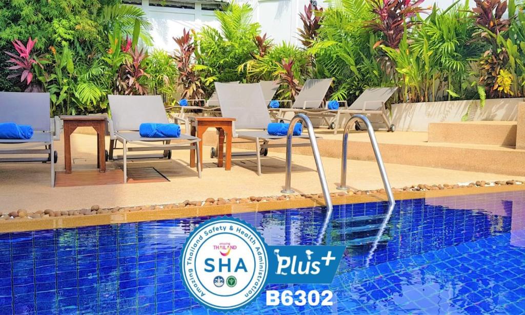 a pool at the shka phu resort and spa at Karon Pool Hotel in Karon Beach