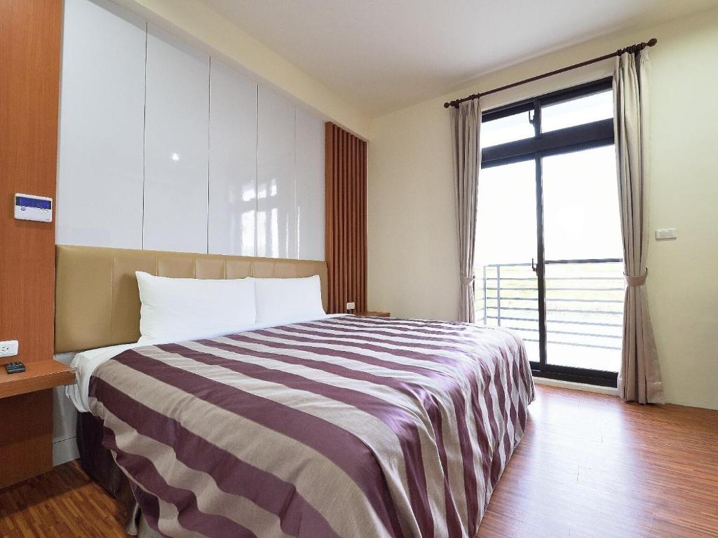 Postel nebo postele na pokoji v ubytování CoCo Motel Boutique