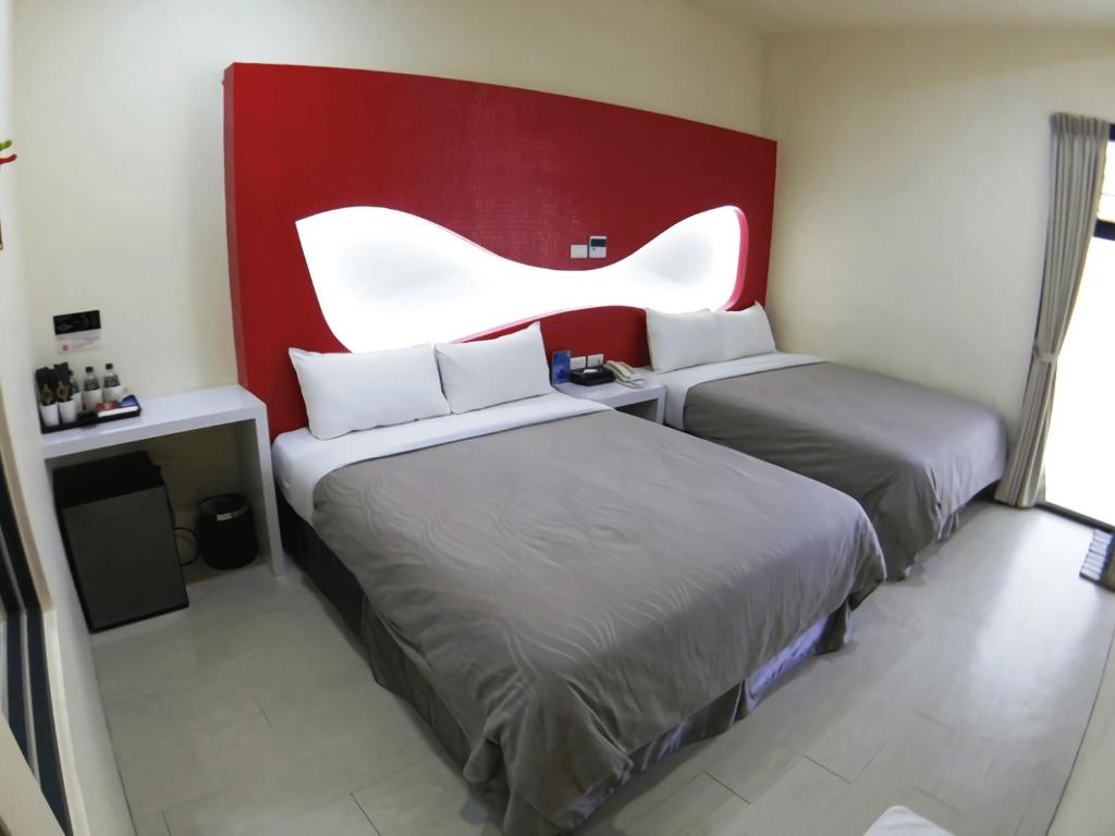 Postel nebo postele na pokoji v ubytování CoCo Motel Boutique