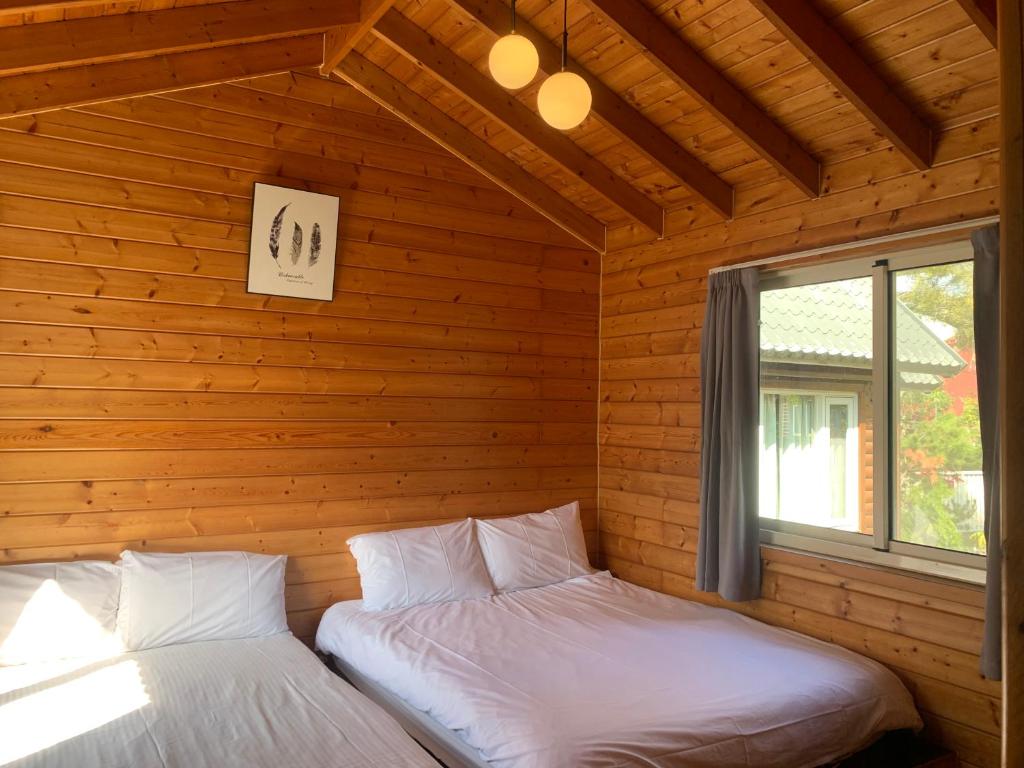 Postel nebo postele na pokoji v ubytování Taomi Diary