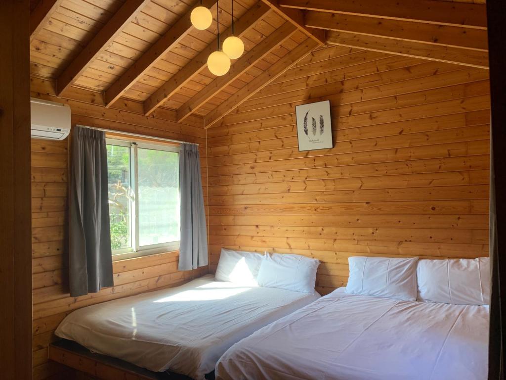 Postel nebo postele na pokoji v ubytování Taomi Diary
