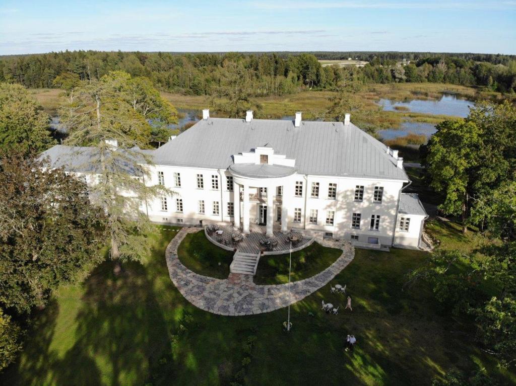 an aerial view of a large white house at Kernu Manor Hotel & SPA in Kernu