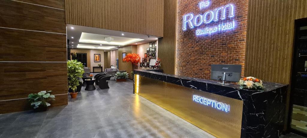 a reception area of a hotel lobby with a reception desk at The Room Boutique Hotel in Sakon Nakhon