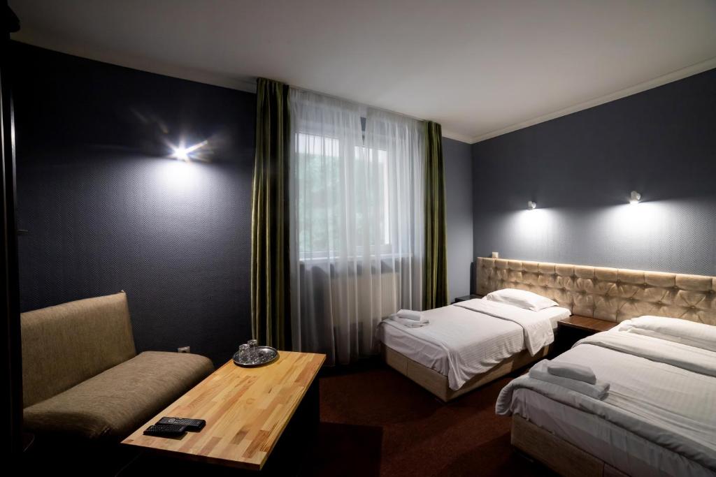 Postel nebo postele na pokoji v ubytování Wellland Hotel