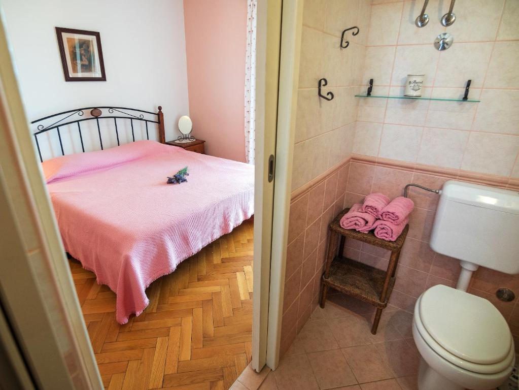 Postel nebo postele na pokoji v ubytování Villa Ana
