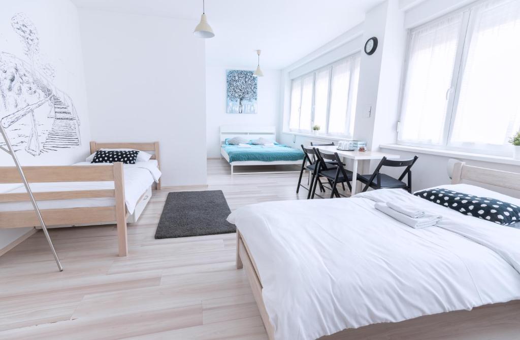 Postel nebo postele na pokoji v ubytování The Dots Hostel