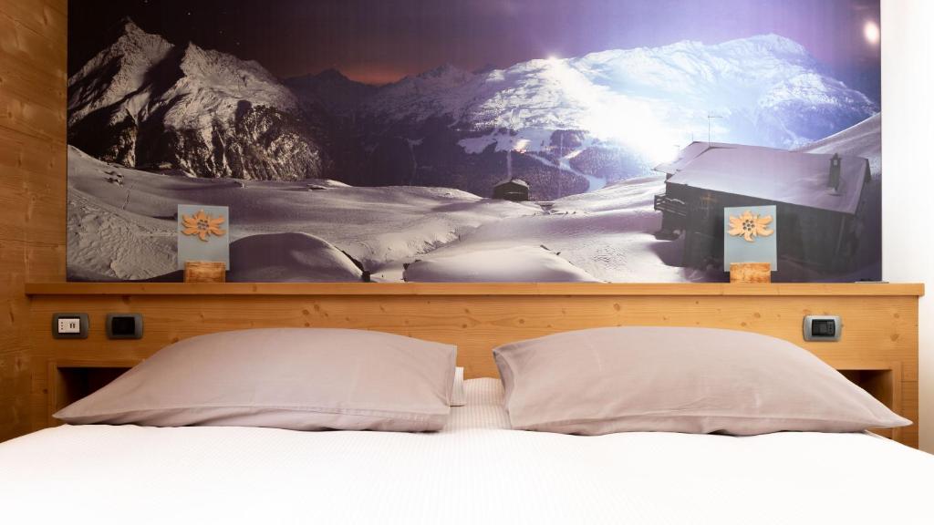 Postel nebo postele na pokoji v ubytování Hotel Compagnoni
