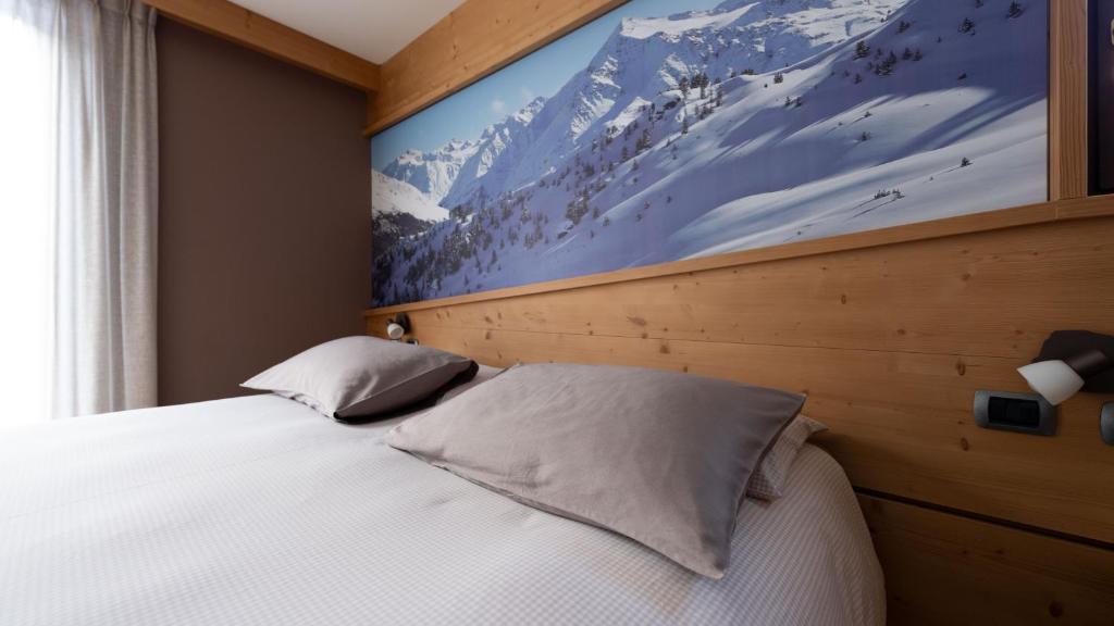 Postel nebo postele na pokoji v ubytování Hotel Compagnoni