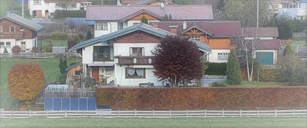 a model of a house with a fence at Ferienwohnung Familie Wieser in Altenmarkt im Pongau